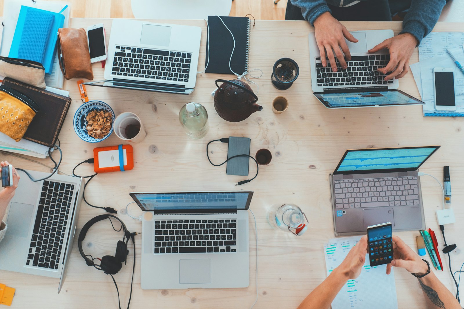 An IT team working together around laptops